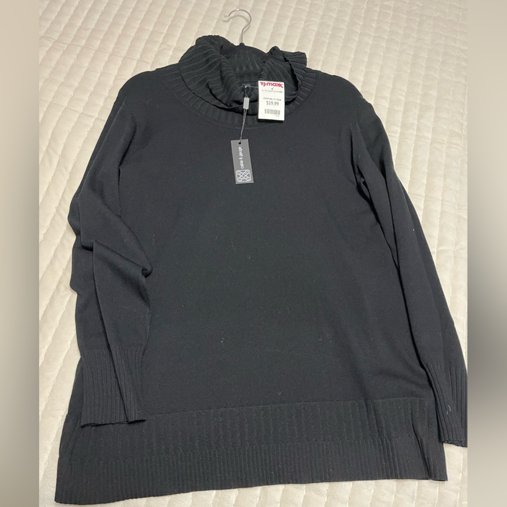 Cable and gauge turtleneck sweater.